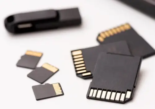 An image of media cards and a flash drive on a blank background.